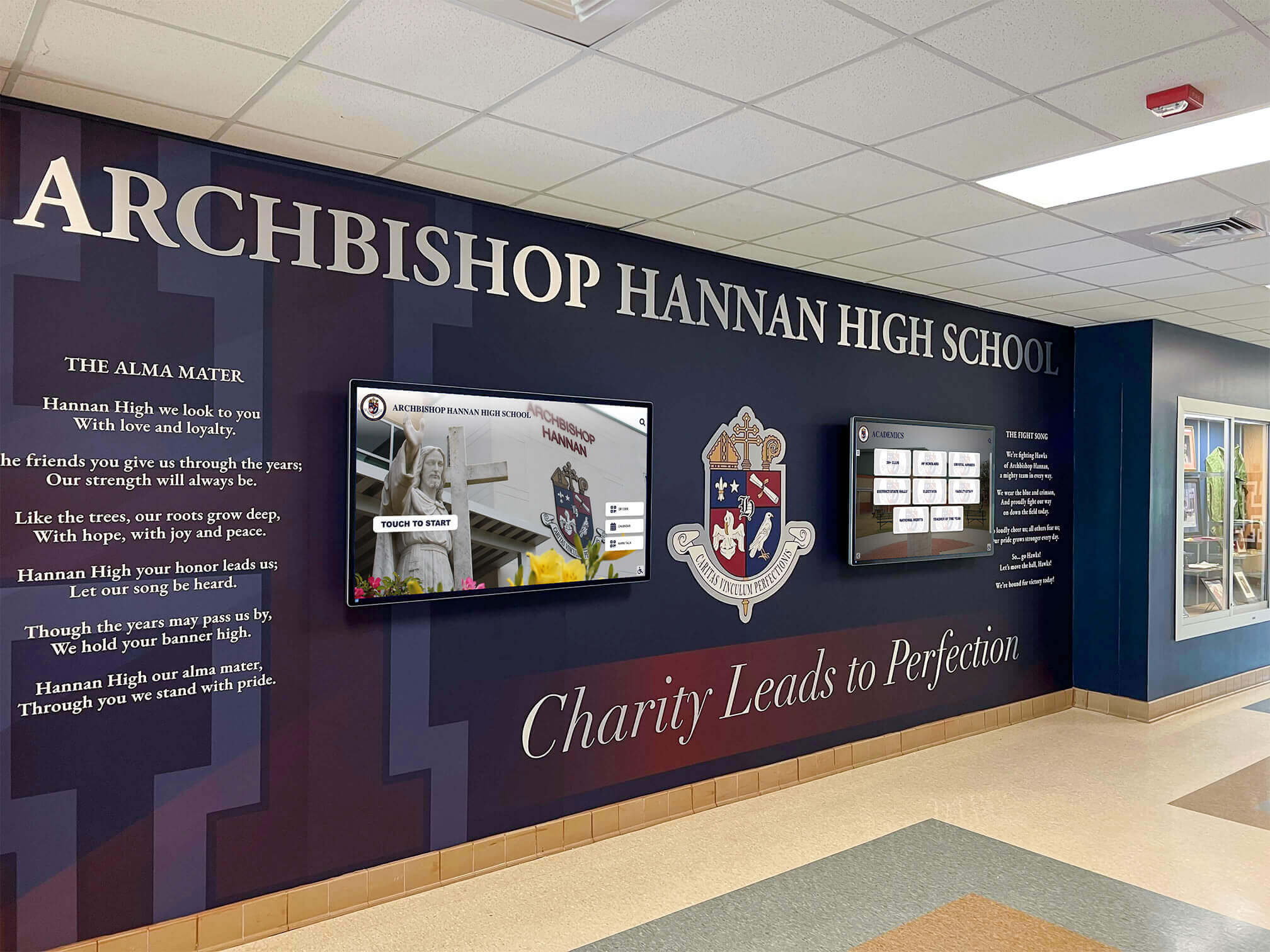 Archbishop Hannan High School lobby with mural and digital screens