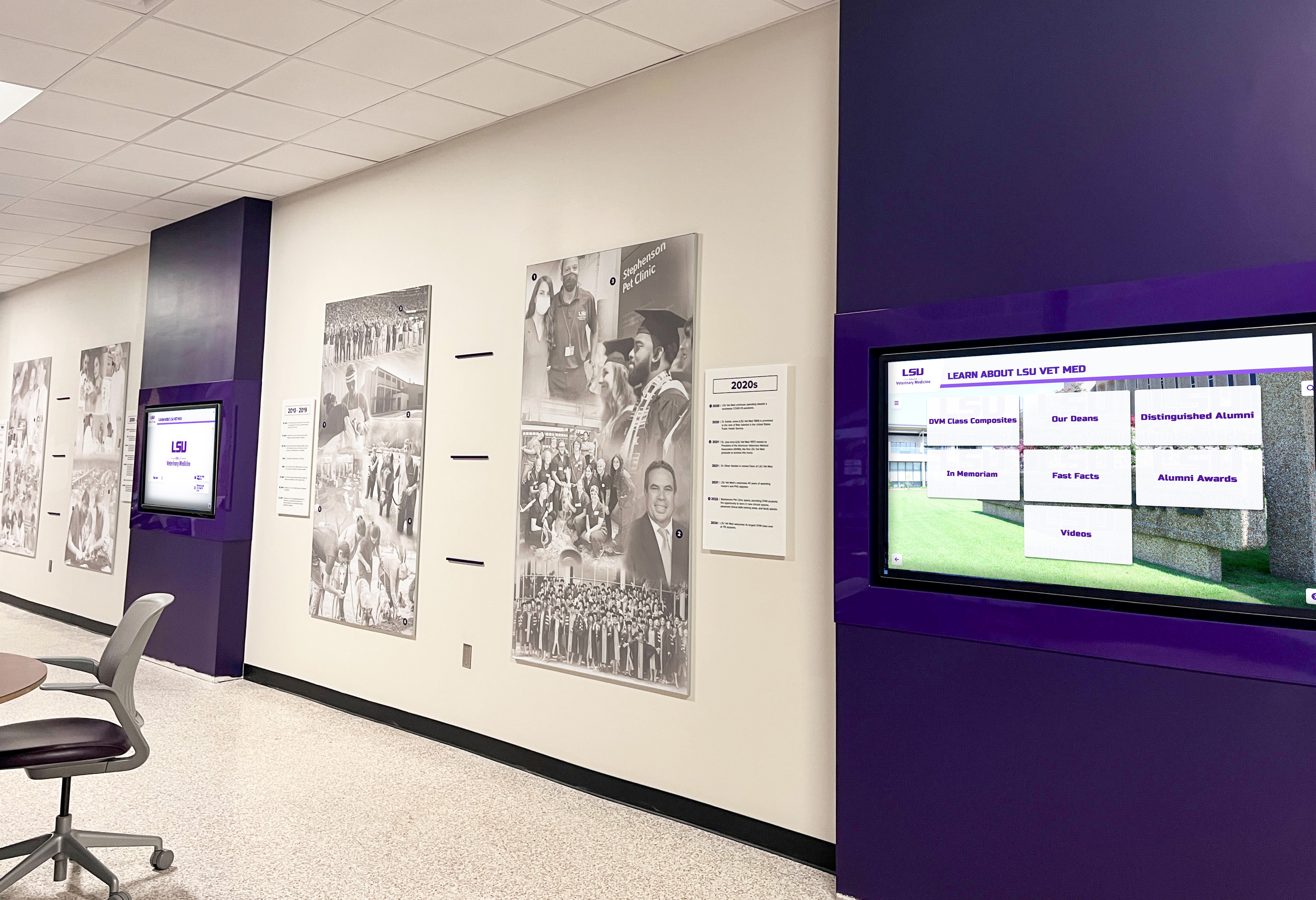 University hallway with purple digital recognition displays for academic achievement LSU Vet Med hallway purple digital displays for student recognition