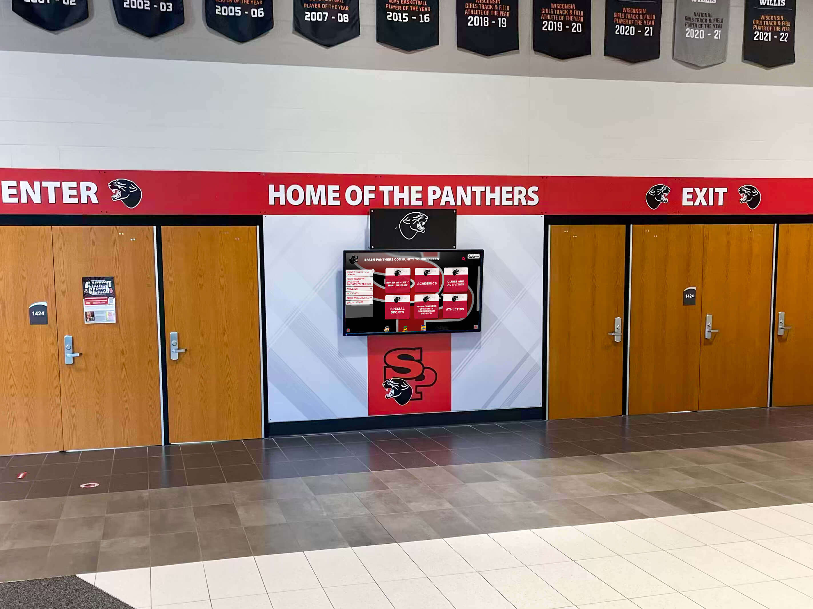 Panthers entrance with digital display in school hallway