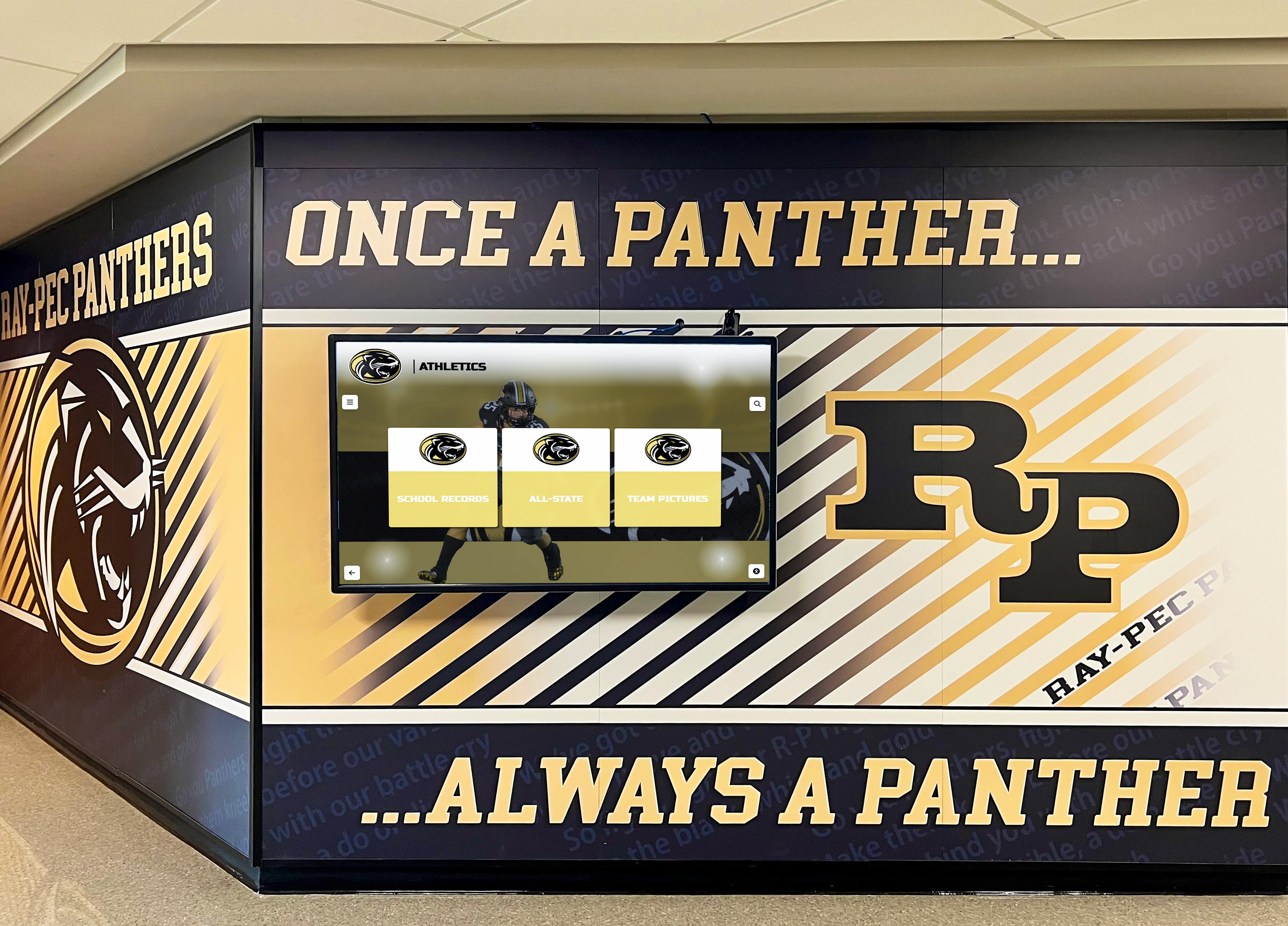 School hallway featuring panther mascot mural with integrated digital screen School hallway panther athletics mural with digital screen