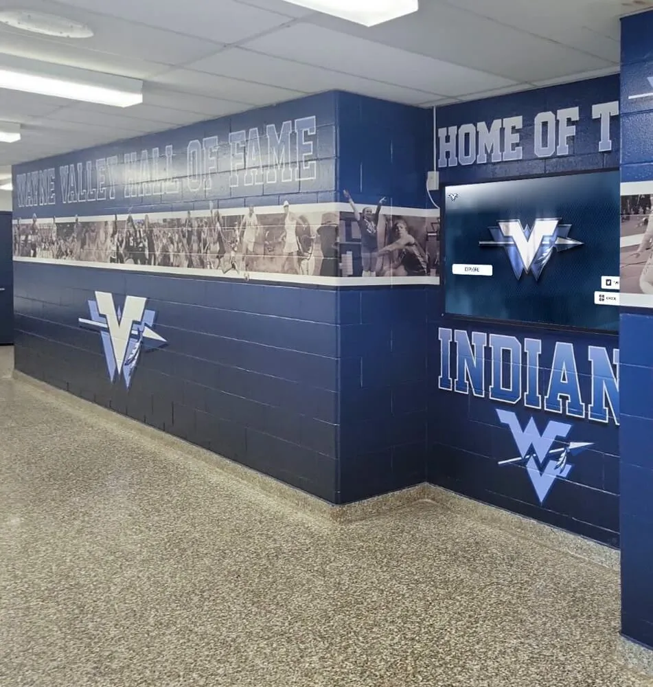 Wayne Valley hall of fame athletic hallway featuring team logo and recognition display