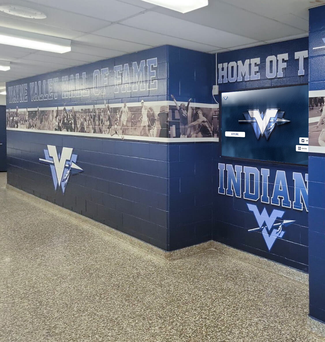 Wayne Valley hallway wall of fame blue mural with program recognition